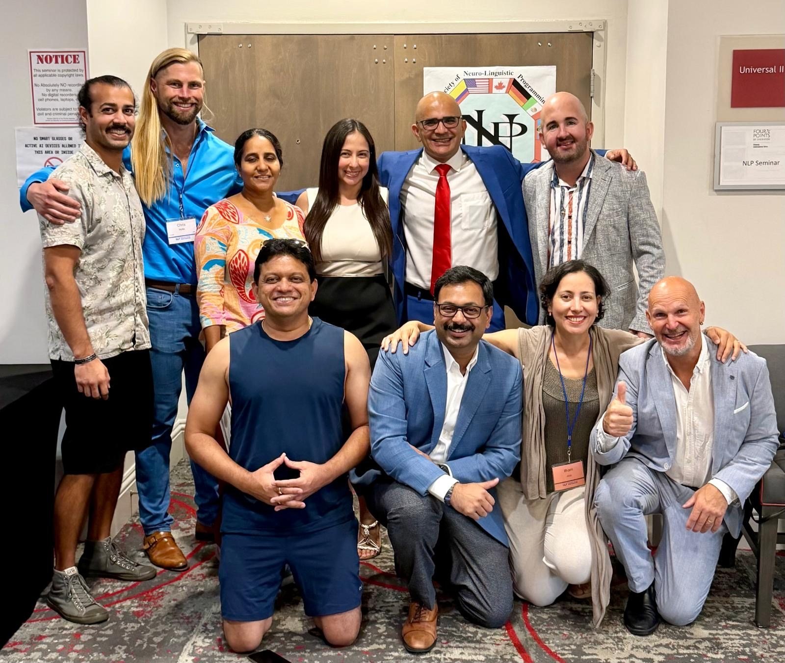 Dr. Maruti Sharma standing at the centre of a group, with Jens Edgren kneeling at the front right giving a thumbs up, 2026
